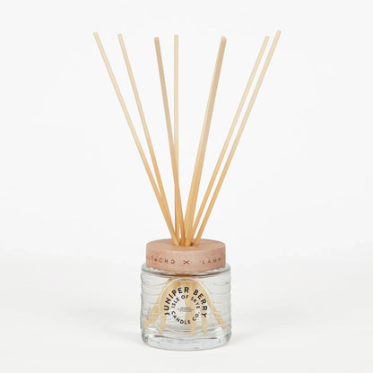 Juniper berry scented reed diffuser in glass container
