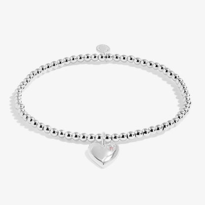 Kids silver beaded bracelet with heart charm set with purple CZ stone