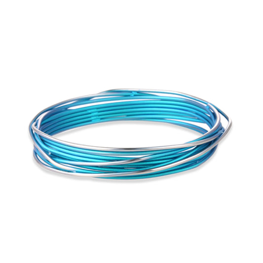 A blue titanium bangle with a wrapped wire design