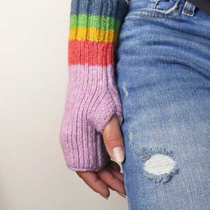 Model wearing lilac purple fingerless gloves with ribbed rainbow striped cuffs 