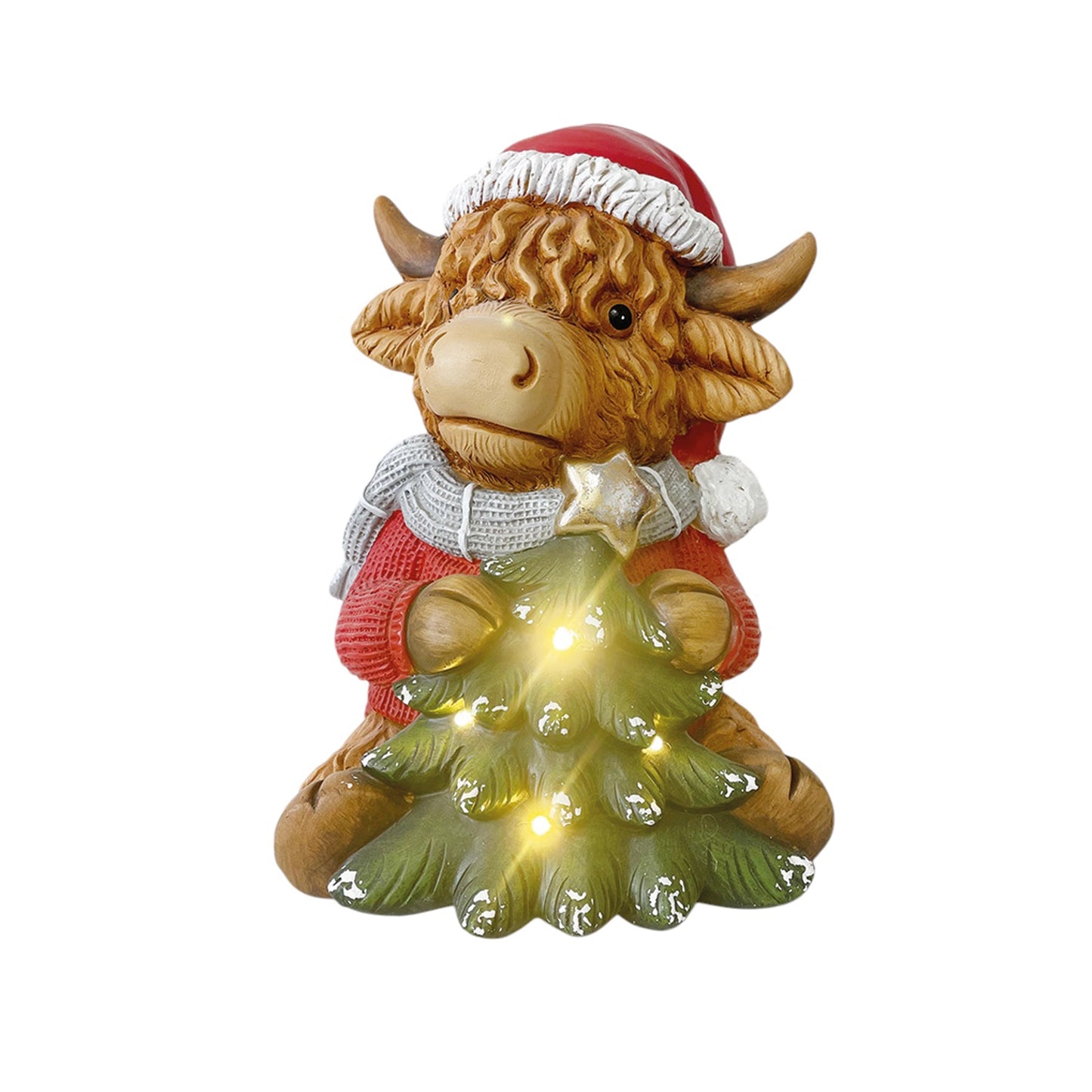 A Highland cow figure in a Santa suit with a light up Christmas tree