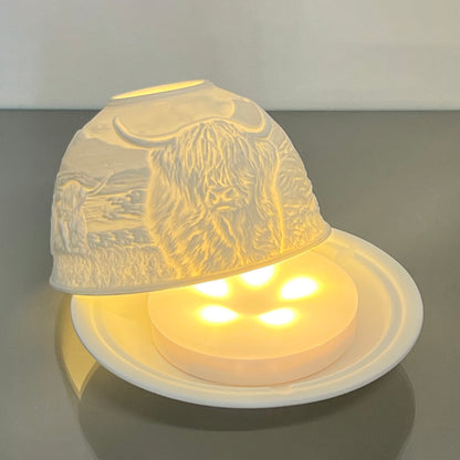Disc shaped LED light box in porcelain Highland cow dome candle holder