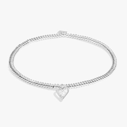 Silver bracelet with heart charm set with a lab grown diamond 