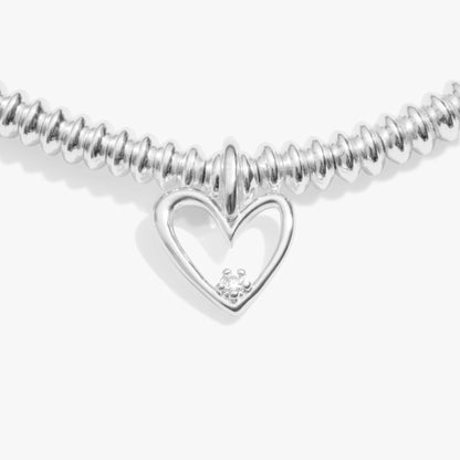 Silver bracelet with an asymmetrical heart charm set with a lab grown diamond detail