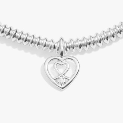 Silver bracelet with a heart inside a heat charm set with a lab grown diamond detail