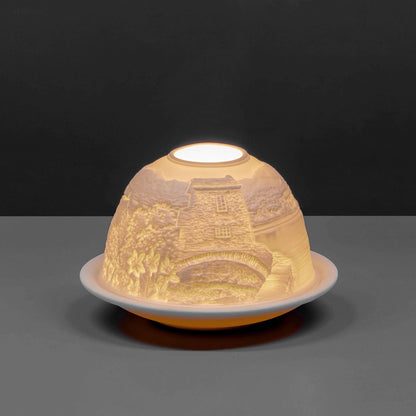 White porcelain tall dome candle holder with engraved Cumbria Lake District scene lit up 2