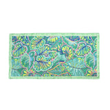 Scarf with a brightly coloured leaf print pattern in pink, blue, yellow and green