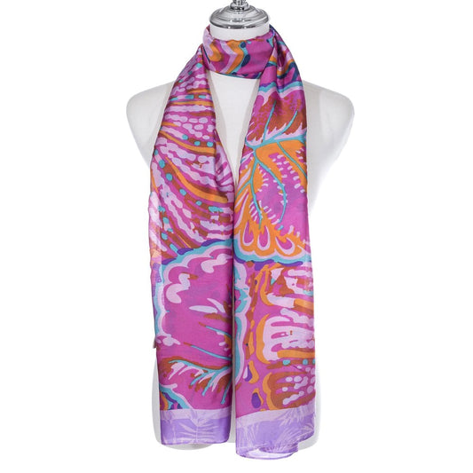A scarf featuring a bright leaf pattern in purple, orange, blue and pink