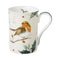 A cream china mug with a robin and holly design