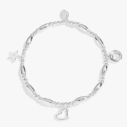 A beaded stretch silver bracelet with two different heart charms and a star