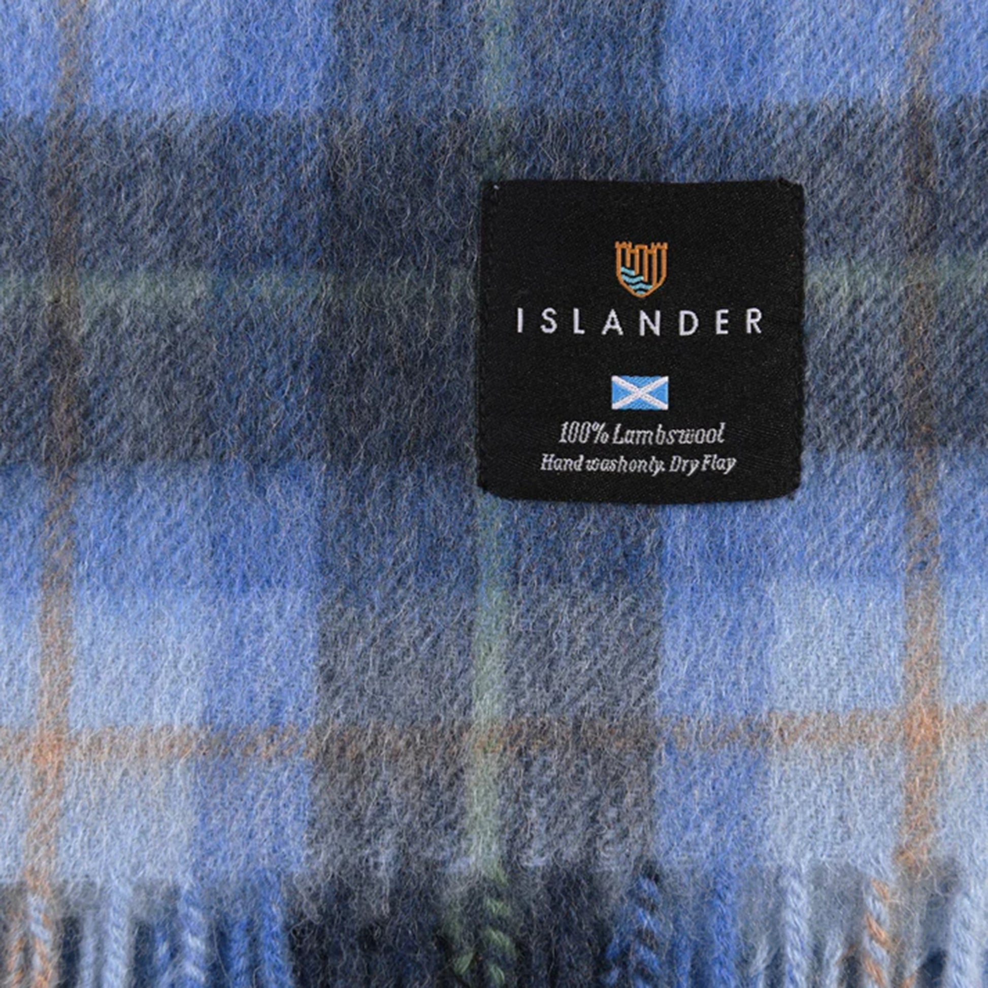 An Islander scarf tag with cleaning instructions