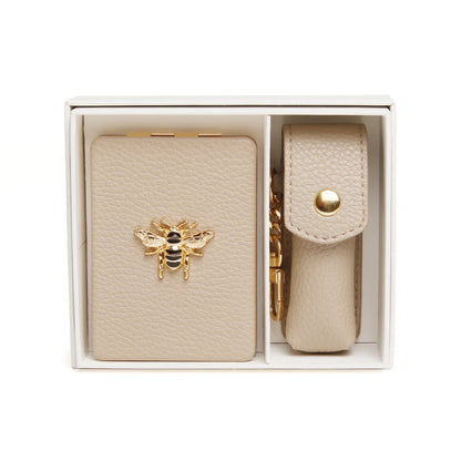 Gift set with oblong compact mirror with bee emblem and a lipstick holder in stone faux leather 