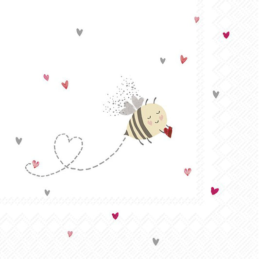 A white napkin featuring a little bee holding a heart