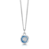 A silver pendant featuring a round organic shape with a CZ in the centre and light blue enamel