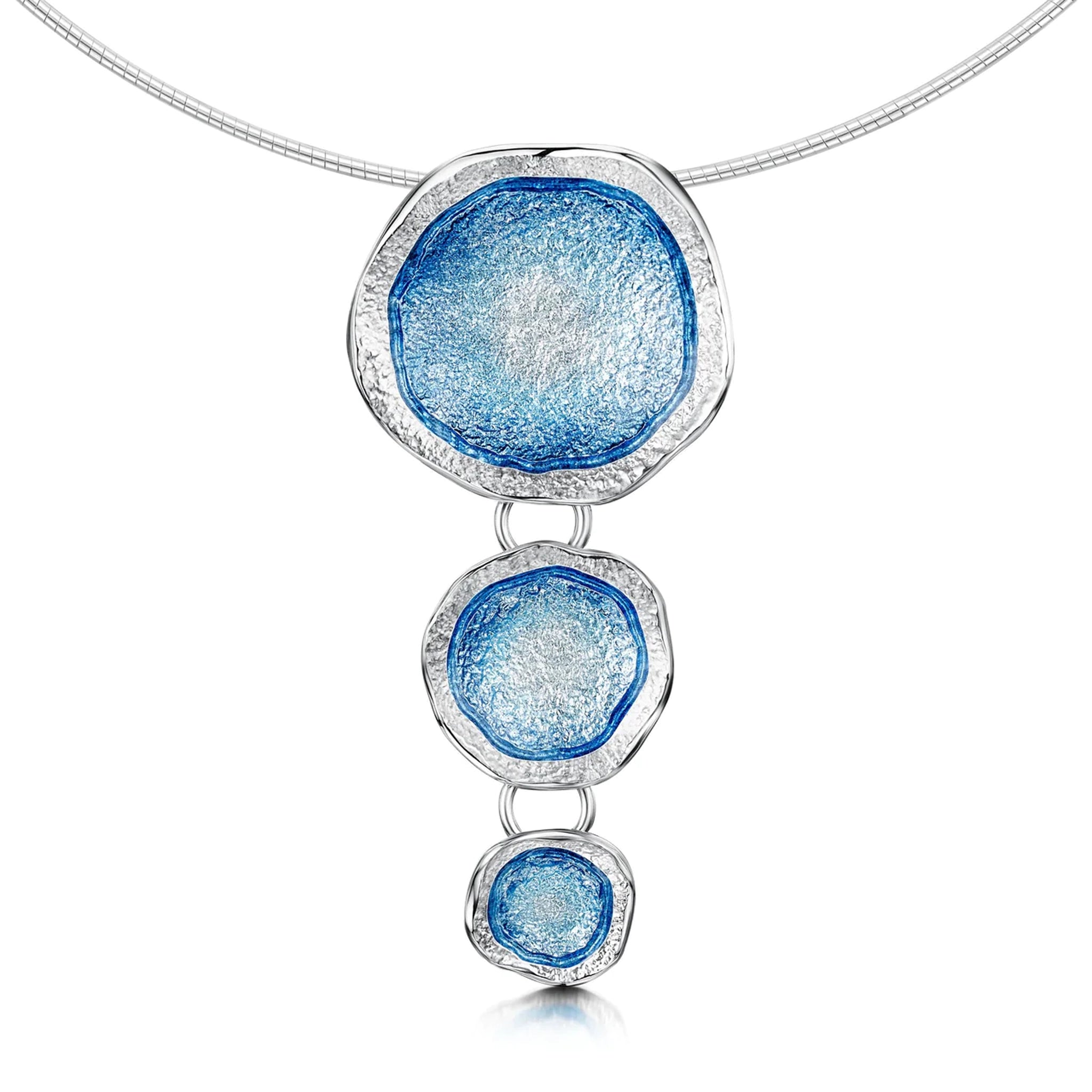 Silver triple necklet on wire, with large pendants in organic shapes with subtle texture and blue enamel centres