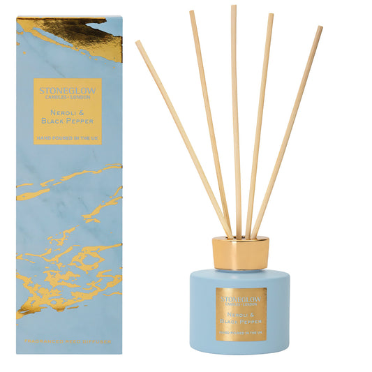 Powder blue and gold marble pattern box with reed diffuser and natural wood reeds