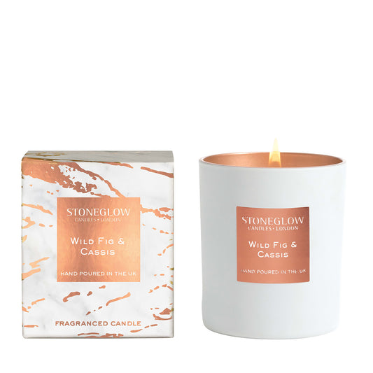 White and metallic rose gold tumbler candle with matching marble patterned box in wild fig & cassis scent