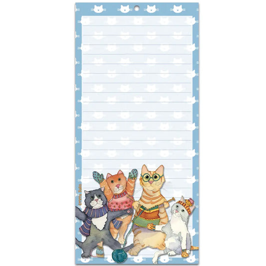 A long notepad featuring an illustration of cats in winter clothes and knitting