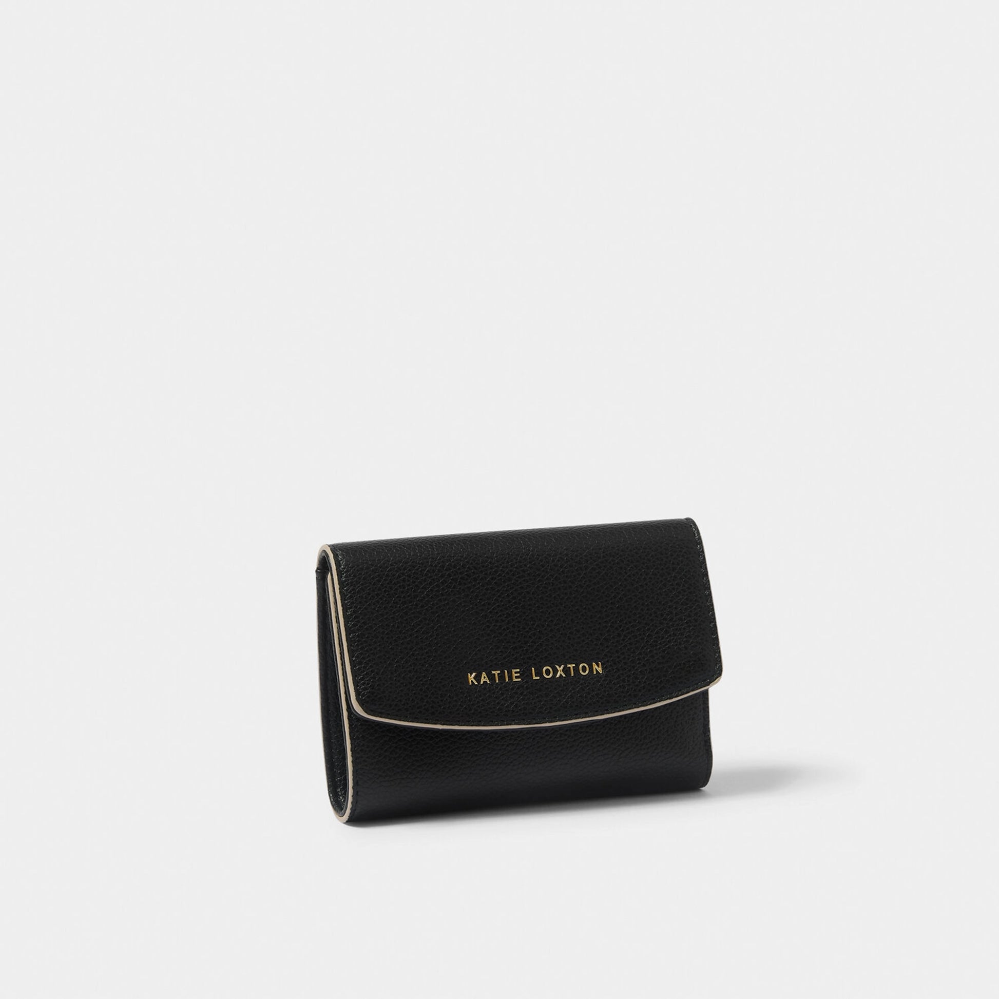 A fold over black vegan leather purse with contrasting sand coloured wax trim