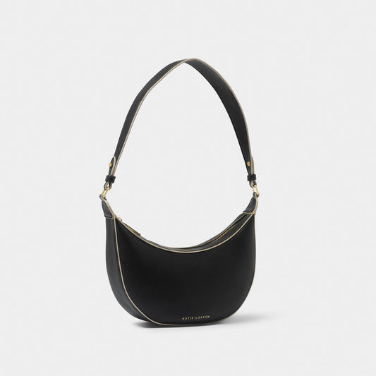 A crescent shaped shoulder bag in black PU with contrasting sand colour wax piping