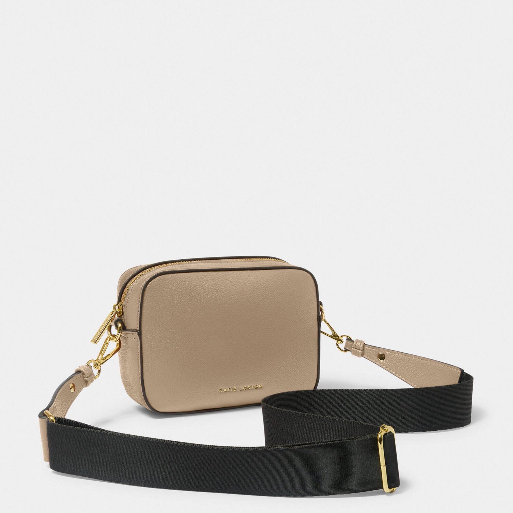 A taupe cross-body bag with contrast wax piping in black