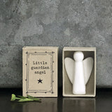 Minimalist white ceramic angel figurine in box that says 'Little Guardian Angel'