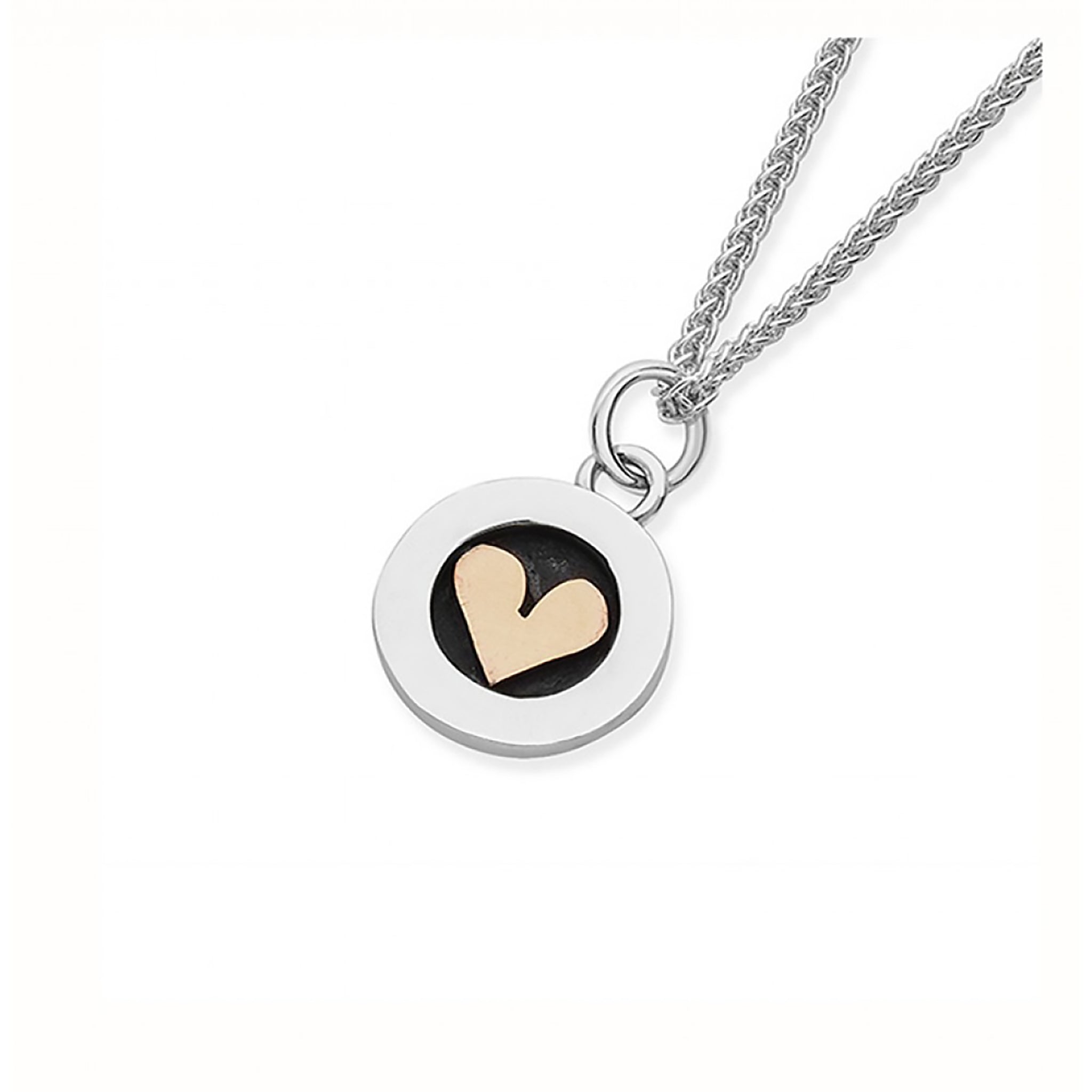 Silver pendant in simple round shape with oxidisation and little gold heart in the centre, on a silver chain