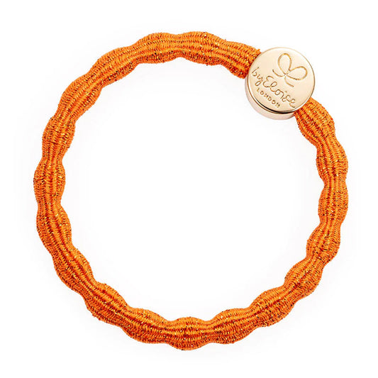 Metallic orange coloured bubble shaped hair tie with gold circle charm