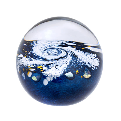 Glass paperweight with swirling milky way galaxy design
