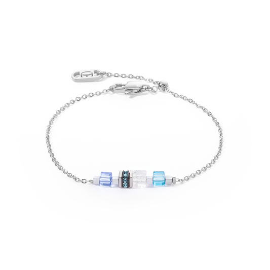 A silver chain bracelet with blue cube shaped stones
