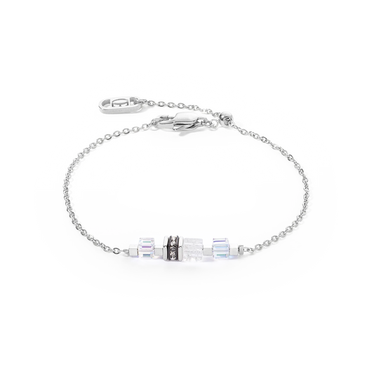 A silver chain bracelet with white cube shaped stones