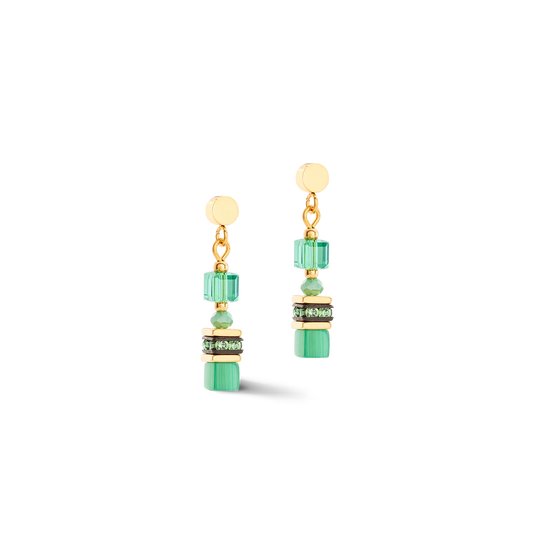 A pair of gold earrings with vibrant green cube shaped stones 