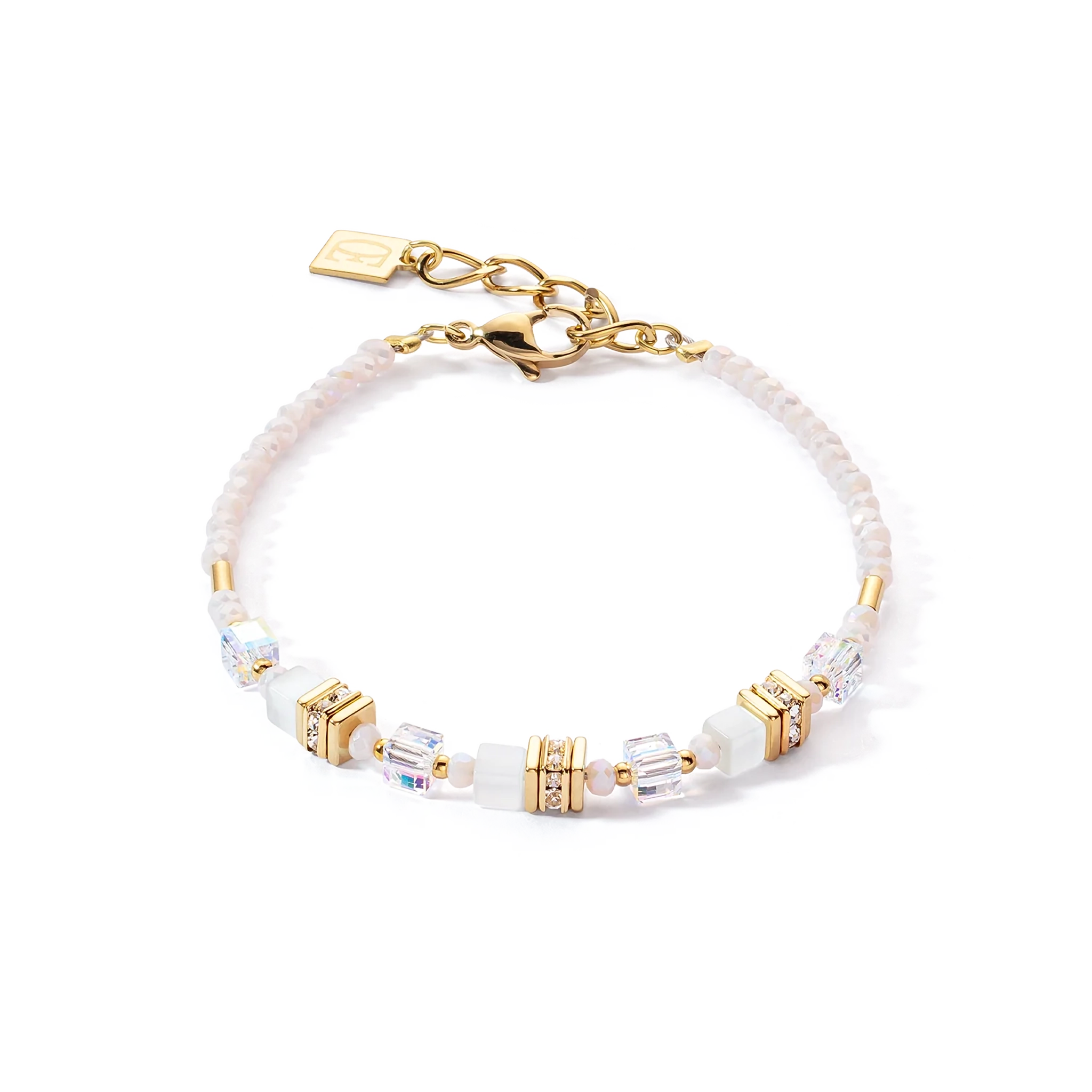 A bracelet with white and gold mini cube shaped stones and cut glass beads