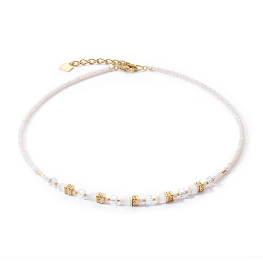 A necklet with white and gold mini cube shaped stones and cut glass beads