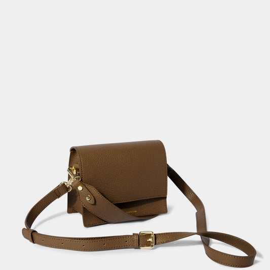 Brown crossbody bag with carry handle and belt buckle style shoulder strap