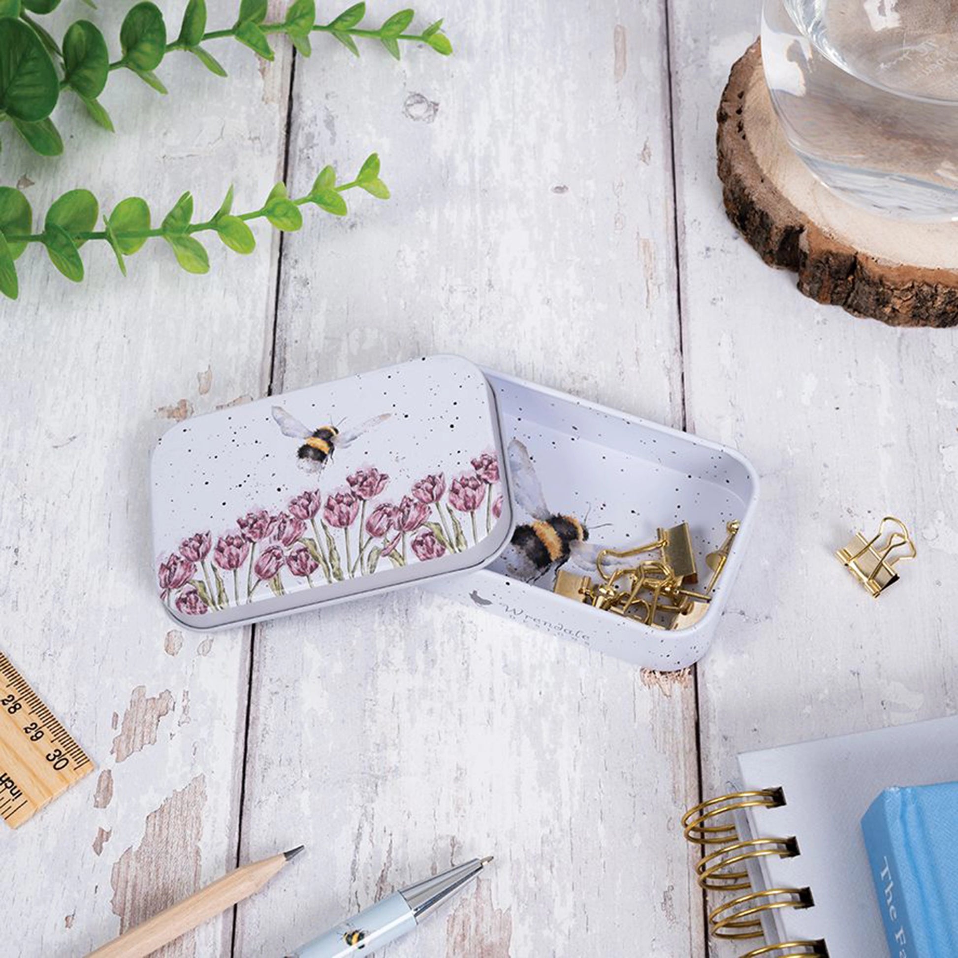 Mini tin fully illustrated with artwork of bees by Hannah Dale lifestyle
