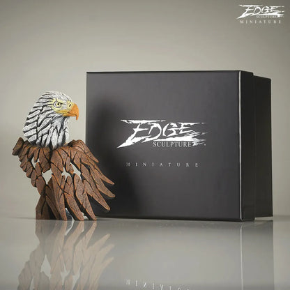Brown and white painted American Eagle bust and wing sculpture next to packaging box