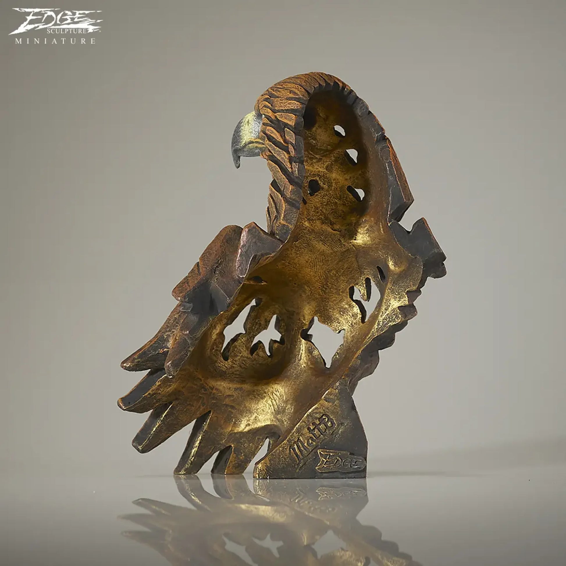 Back of a brown painted golden eagle bust and wing sculpture