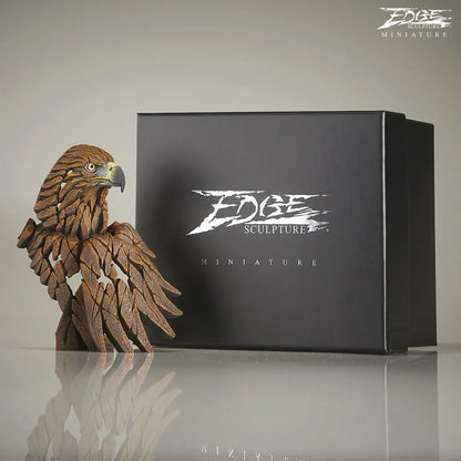 Brown painted golden eagle bust and wing sculpture next to packaging box