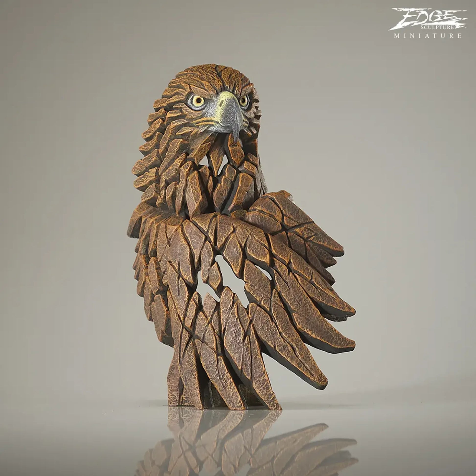 Front of brown painted golden eagle bust and wing sculpture