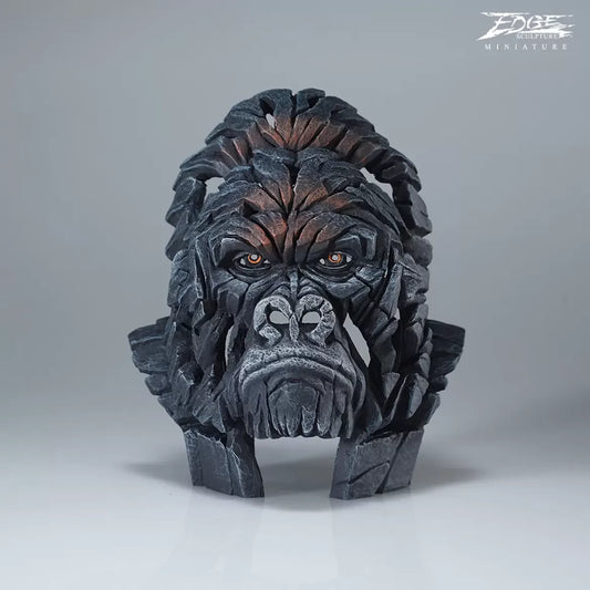 A textured and painted gorilla head bust sculpture 