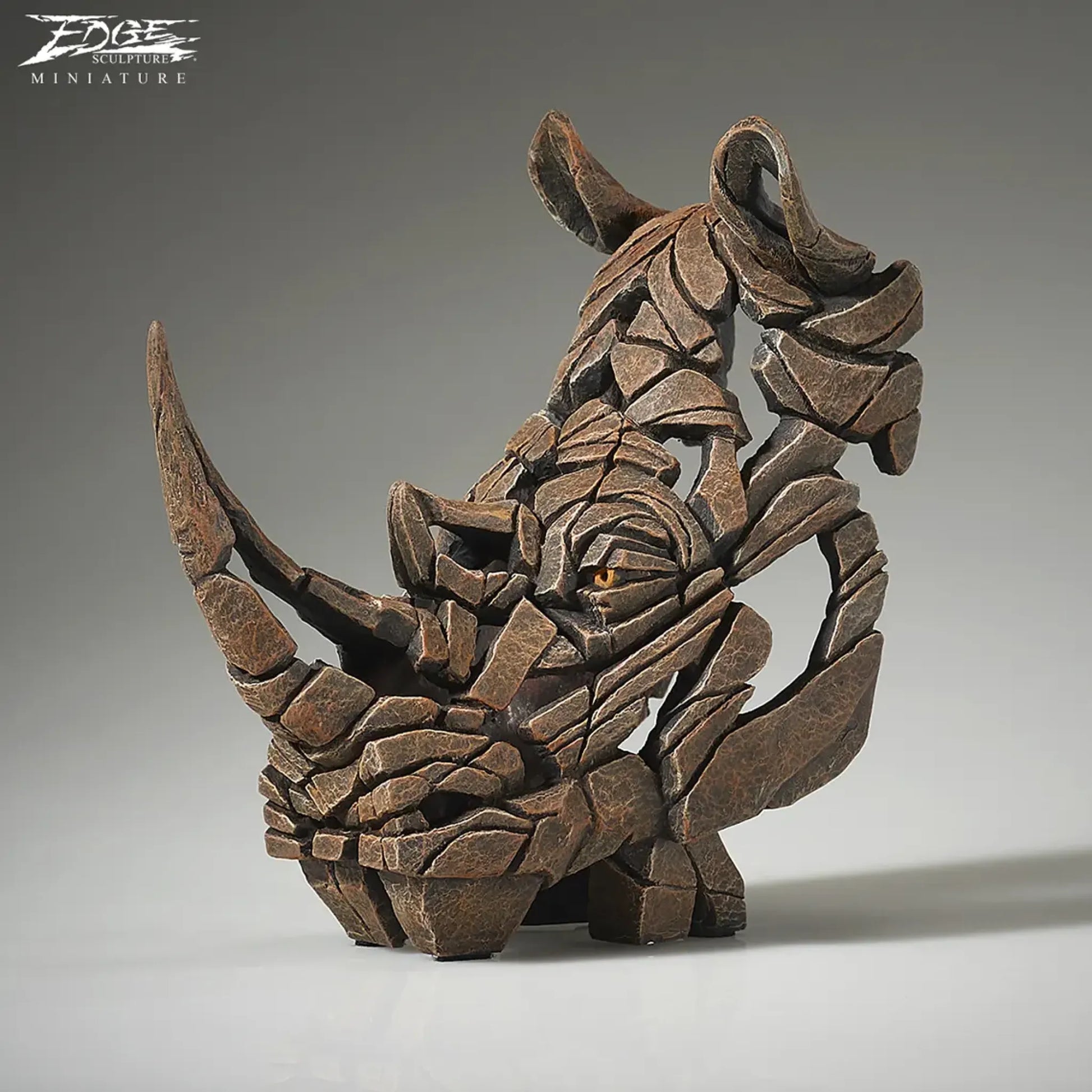 Rhinoceros bust sculpture in brown side