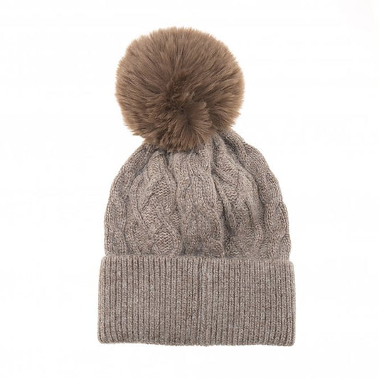 A simple light mink brown cable knit hat with large fluffy pompom