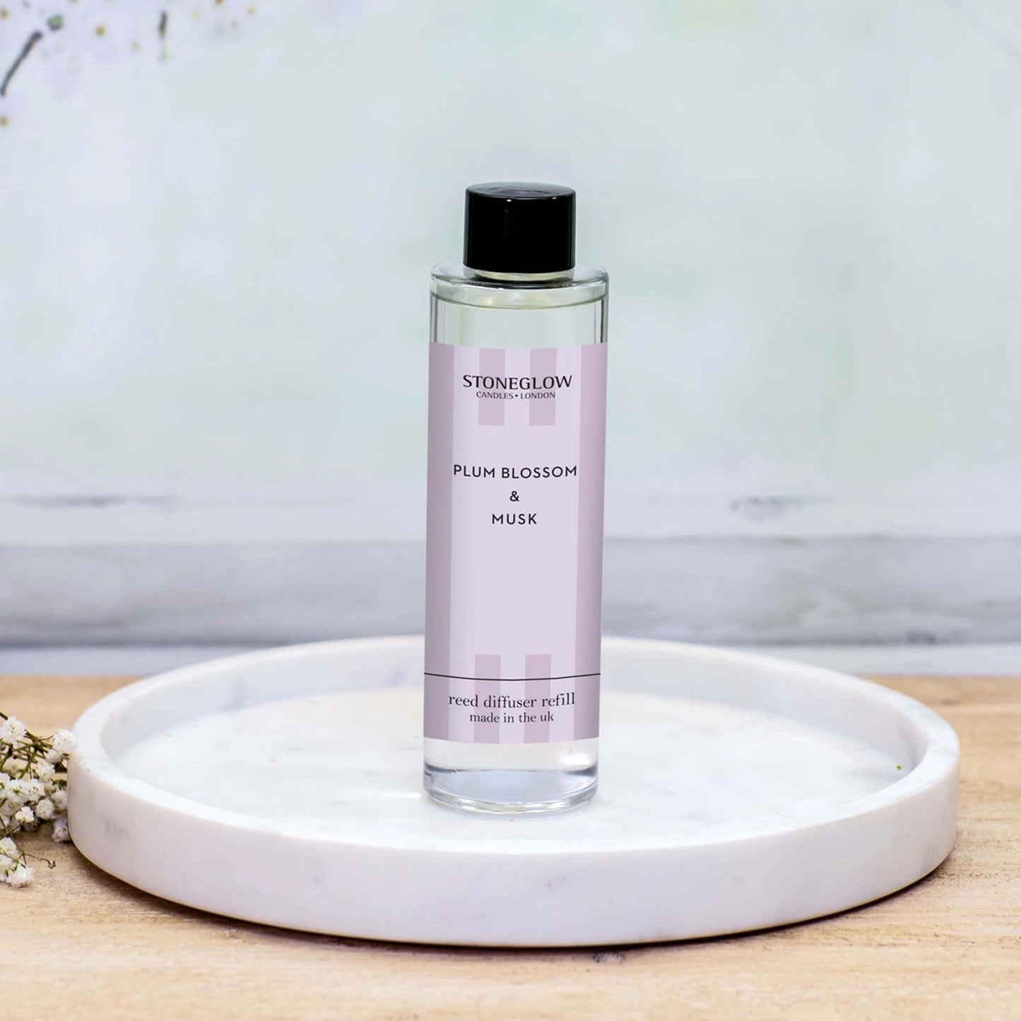 Stoneglow Plum Blossom & Musk reed diffuser refill bottle lifestyle
