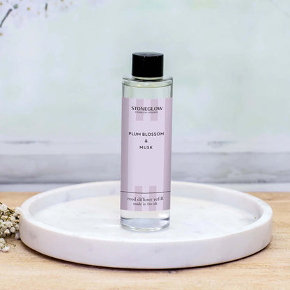 Stoneglow Plum Blossom & Musk reed diffuser refill bottle lifestyle