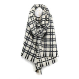 A black and white check scarf with subtle fringe detail