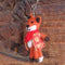 A felted fox keyring wearing a checked waistcoat and a red scarf