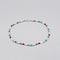 A beaded anklet with cylindrical multicoloured semi precious stones and silver ball spacers