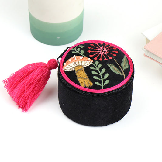 A black velvet zip up trinket jewellery box with embroidered mushrooms and foliage