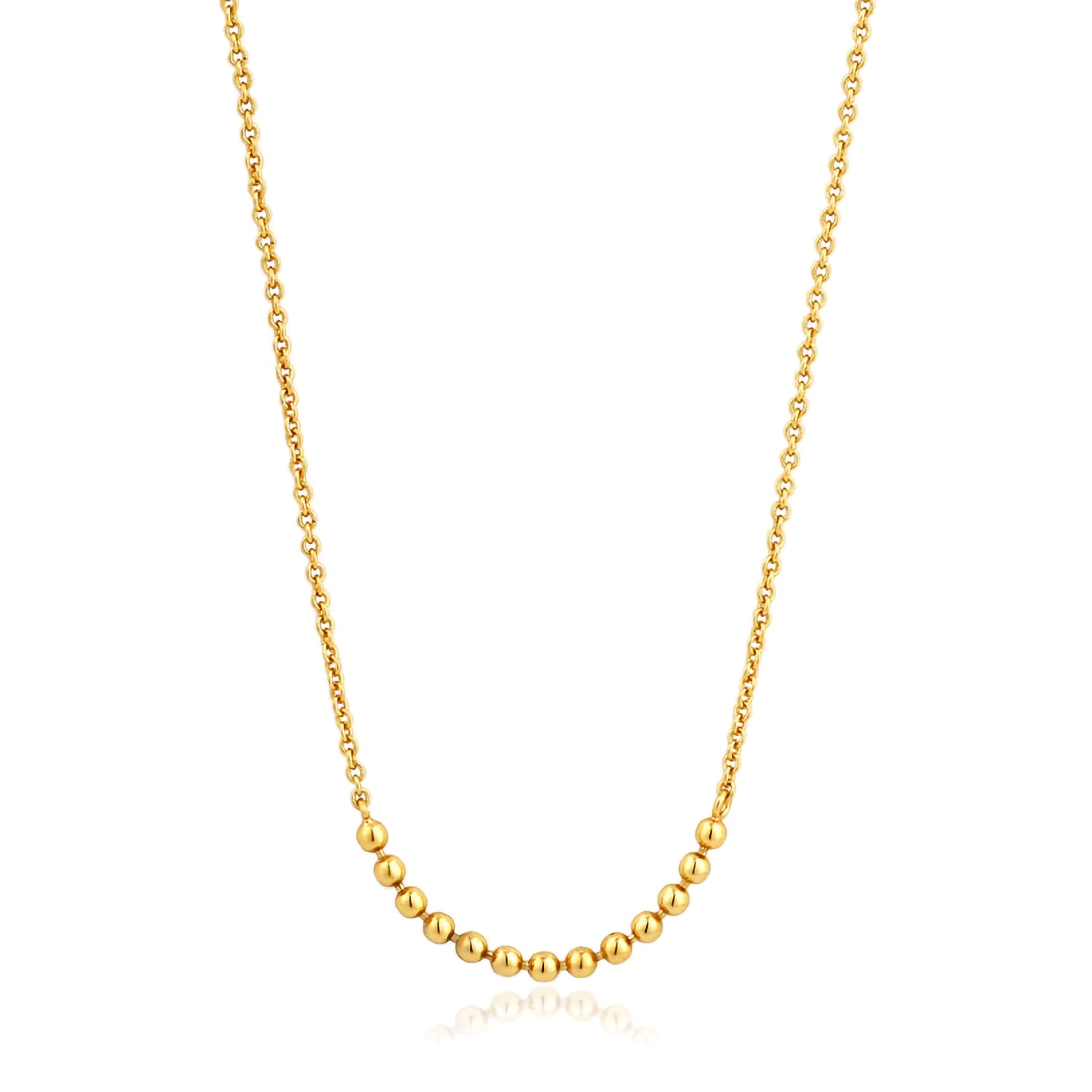 A gold chain necklace featuring a bar of linked gold balls